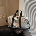 Large silver waterproof travel bag with black handles and adjustable shoulder strap - Silver