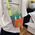 Colorful nylon crossbody bag with blue, orange and green panels and adjustable strap - Orange