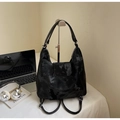 Detail of black marble textured tote backpack featuring magnetic flap and silver hardware - Black (Without Charm)