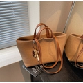 Minimalist tan canvas tote bag with synthetic leather straps and wooden bead charm - Khaki