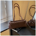 Detail of leopard print suede handbag with drawstring knots and silver zipper closure - Brown