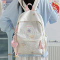 White quilted backpack with colorful star patches and a heart-shaped plush charm - White Large