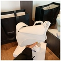 Detail of white litchi grain leather puzzle bag with geometric patchwork structure - White