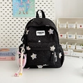Black quilted backpack with colorful star patches and a cute pink heart charm accessory - Black Small