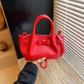 Red lychee pattern leather bucket bag with bow detail and adjustable shoulder strap - Red