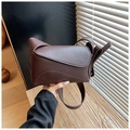 Detail of dark brown lychee textured leather shoulder bag with geometric folding flap - Brown