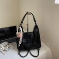 Sleek black cloud-textured backpack with plush bear charm and woven ribbon detail - With Charm / Black