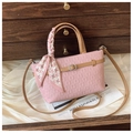Pink quilted bucket bag with brown handles and houndstooth silk scarf detail - Pink