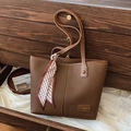 Brown litchi grain leather tote bag with silk scarf accessory in dark wood drawer - Brown
