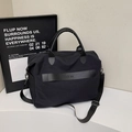 All-black nylon crossbody travel tote bag with leather straps and adjustable shoulder band - Black