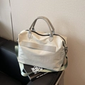 Light gray large capacity crossbody tote bag with green strap for women in 2026 style - White