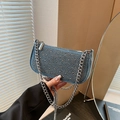 Blue denim baguette bag with silver rivets and metallic chain strap in casual style - Light Blue
