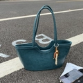 Large teal woven leather tote bag with stylish beaded tassel and slim shoulder straps - Iceland Blue