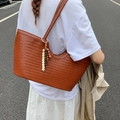Brown woven leather tote bag with wooden bead charm and long shoulder straps - Brown