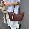 Dark brown hand-woven large tote bag with a decorative wooden bead tassel accent - Brown
