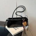 Black soft leather baguette bag with embossed logo and plush bear charm decoration - Black