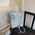 Light blue mesh crossbody bag with floral and butterfly embroidery details - Silver