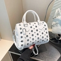 Chic white Boston bag with silver punk rivets, featuring dual handles and crossbody strap - White