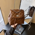 Brown quilted mini backpack with silver chain detail and metallic twist lock - Brown