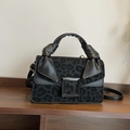 Elegant black leopard print handbag with knotted handle and metal buckle detail - Black