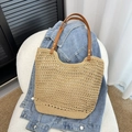 Beige woven crochet tote bag featuring brown leather handles and golden rivet details - Khaki
