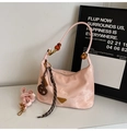 Detailed view of pink cloud nylon hobo bag with amber bead strap and triangle logo - Pink