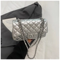 Detail of silver quilted crossbody bag with metal chain strap and twist-lock closure - Silver