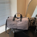 Large grey-purple travel duffel bag with ruched texture and adjustable shoulder strap - Purple