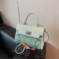 Chic mint green crossbody bag with embossed floral texture and silver metal twist lock - Blue