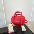 Mini red lychee leather pillow bag with top handle and crossbody strap - Red