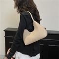 Chic beige hobo bag with textured woven fabric and asymmetric crescent moon silhouette - Khaki