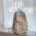 Mochila de patchwork en tres colores verde, naranja y crema con bordado de estrella - Azul