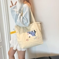 Sac fourre-tout en toile crème avec broderie requin bleu et bande latérale jaune - Requin