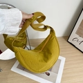 Minimalist yellow nylon crescent bag featuring a wide adjustable shoulder strap - Yellow