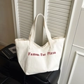 White canvas tote bag with red Famous For Pizza lettering print and dual shoulder straps - White