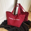 Deep red canvas tote bag with white Famous For Pizza lettering print and thick handles - Red