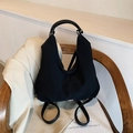 Sac à dos et sac hobo polyvalent en toile noire avec sangles en cuir et boucles en métal - Noir