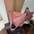 Minimalist lavender nylon bucket bag with adjustable strap and shunuo woven label - Pink
