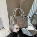 Silver marble pattern bucket bag with plush charm and dual handles in mirror reflection - Silver