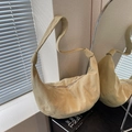 Minimalist beige dumpling shoulder bag featuring a knotted strap and soft suede texture - Khaki