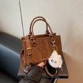 Brown vintage marbled pattern PU leather bucket bag with fashion text and plush charm - Coffee