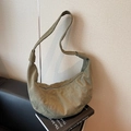 Minimalist military green canvas dumpling bag with signature knot and crossbody strap - Green