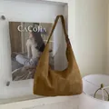 Brown suede minimalist hobo bag with adjustable strap and vintage crescent shape - Brown