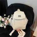 Minimalist off-white PU leather backpack with silver logo and magnetic flap cover - White