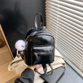 Black mini PU leather backpack with a plush eye charm and a practical front zipper pocket - Black with Pendant