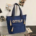 Dark blue nylon backpack featuring cream GTYLF 3D embroidery and multiple pockets - Shoulder Bag / Blue