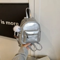 Mini silver metallic faux leather backpack with white faux fur pompom charm and zipper - Silver (With Pendant)