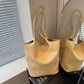 Minimalist yellow lychee texture tote bag with slim shoulder straps and spacious interior - Yellow