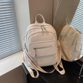 Chic white pebble leather backpack with fashion jacquard straps and silver charms - Off White