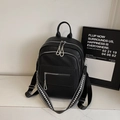 Black pebbled leather fashion backpack with multi-zipper and geometric straps - Black